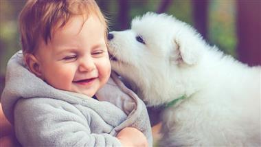 child with pet dog
