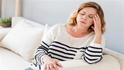 Menopause woman experiencing headache