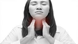 Woman suffering from a sore throat