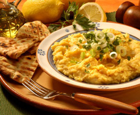 Freshly made hummus topped with spring onion, parsley and olive oil, served with toasted pita bread and lemon.