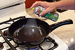 putting coconut oil on skillet