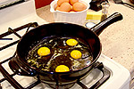 cooking eggs on skillet