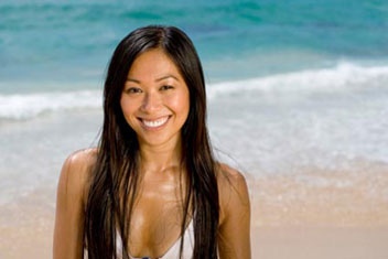 woman tanning on the beach in the sun