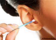 cleaning ears with cotton swabs