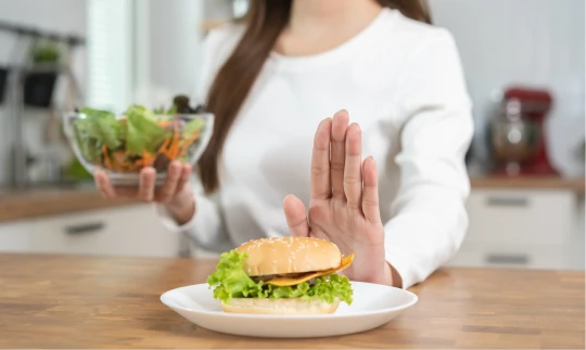 woman rejecting fast food